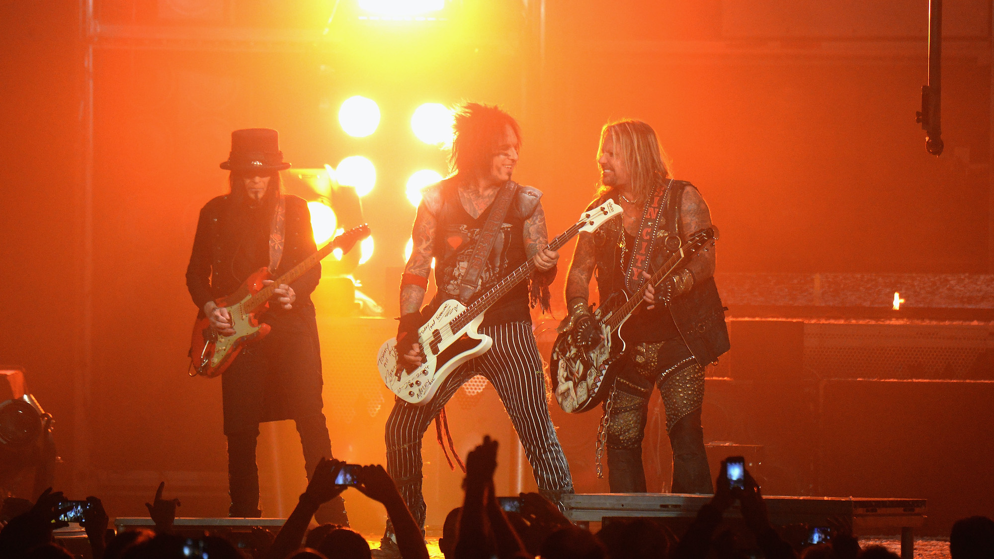(from left) Mick Mars, Nikki Sixx and Vince Neil of M&ouml;tley Cr&uuml;e perform at at Madison Square Garden on October 28, 2014 in New York City