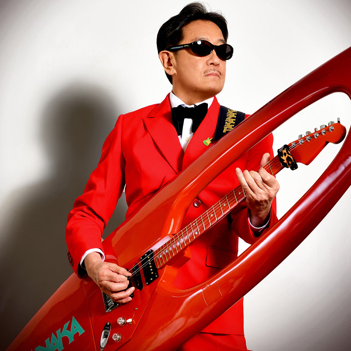 Masayoshi Takanaka with his red surfboard guitar