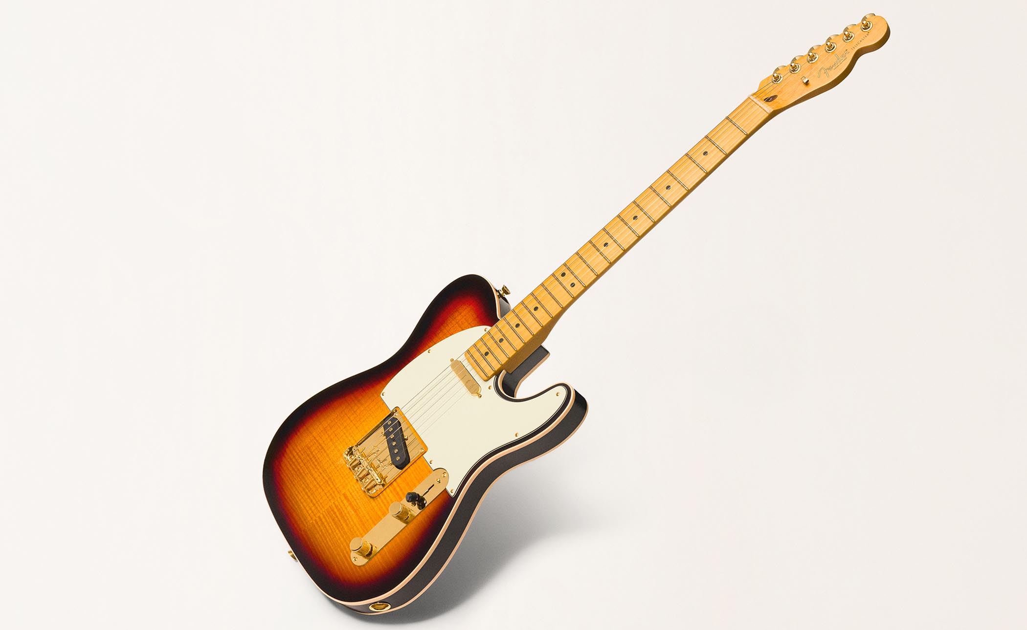 The Fender 75th Anniversary Telecaster collection comprises five limited edition models, including an American Professional Custom Telecaster in 2-tone Sunburst, an American Ultra II Telecaster in Liquid Gold, a Vintera Road Worn 1951 Telecaster in Butterscotch Blonde, an American Professional Classic Cabronita, and a Player II Telecaster in Diamond Dust Sparkle.