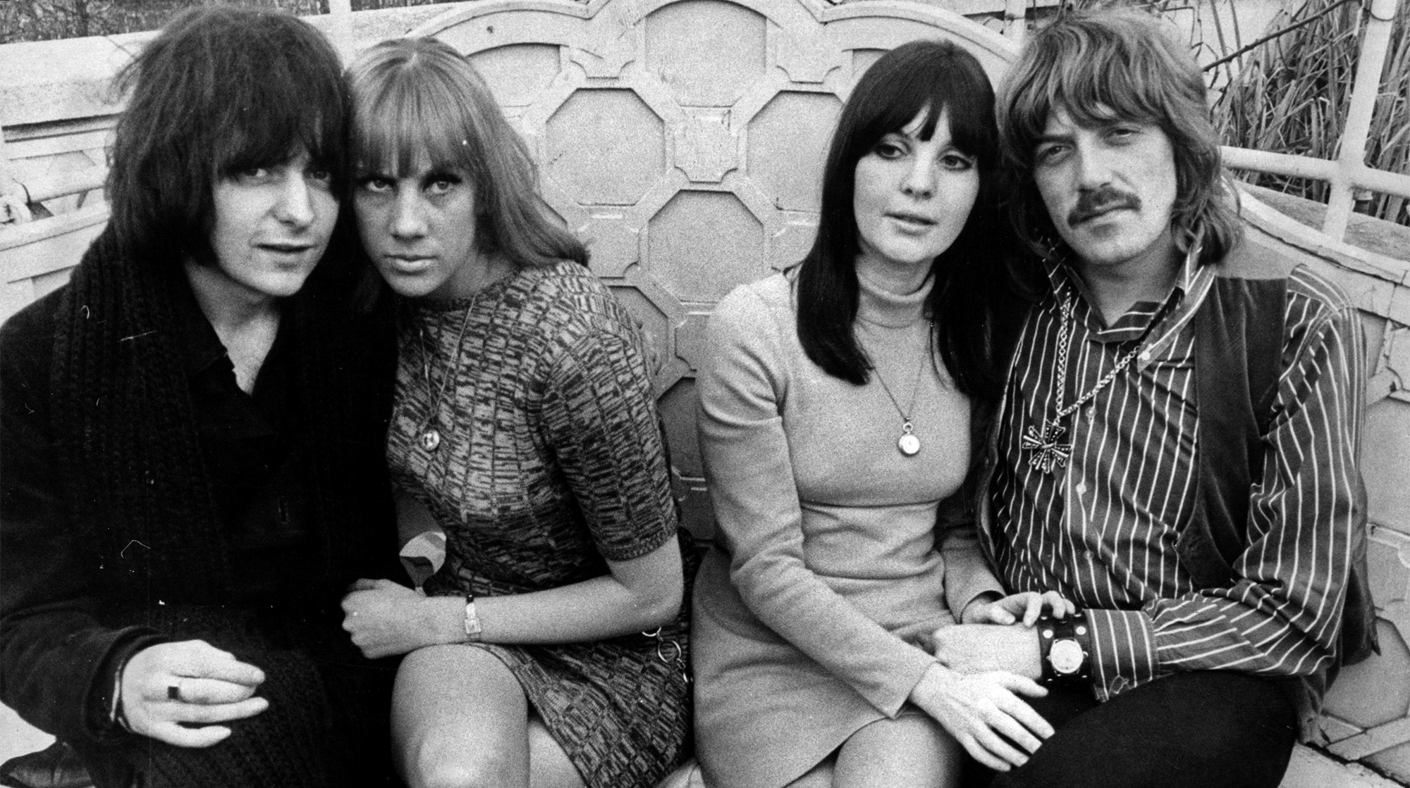 3rd January 1969: Rock guitarist Ritchie Blackmore, left, and keyboard player Jon Lord, right, of the group Deep Purple celebrate both their engagements to their respective girlfriends Babs Hardie and Judy Fielding, on the roof terrace at the Dorchester Hotel, London.