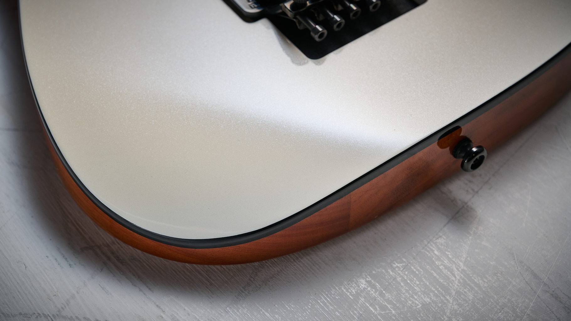The arm rest on a Harley Benton Fusion IV HH electric guitar