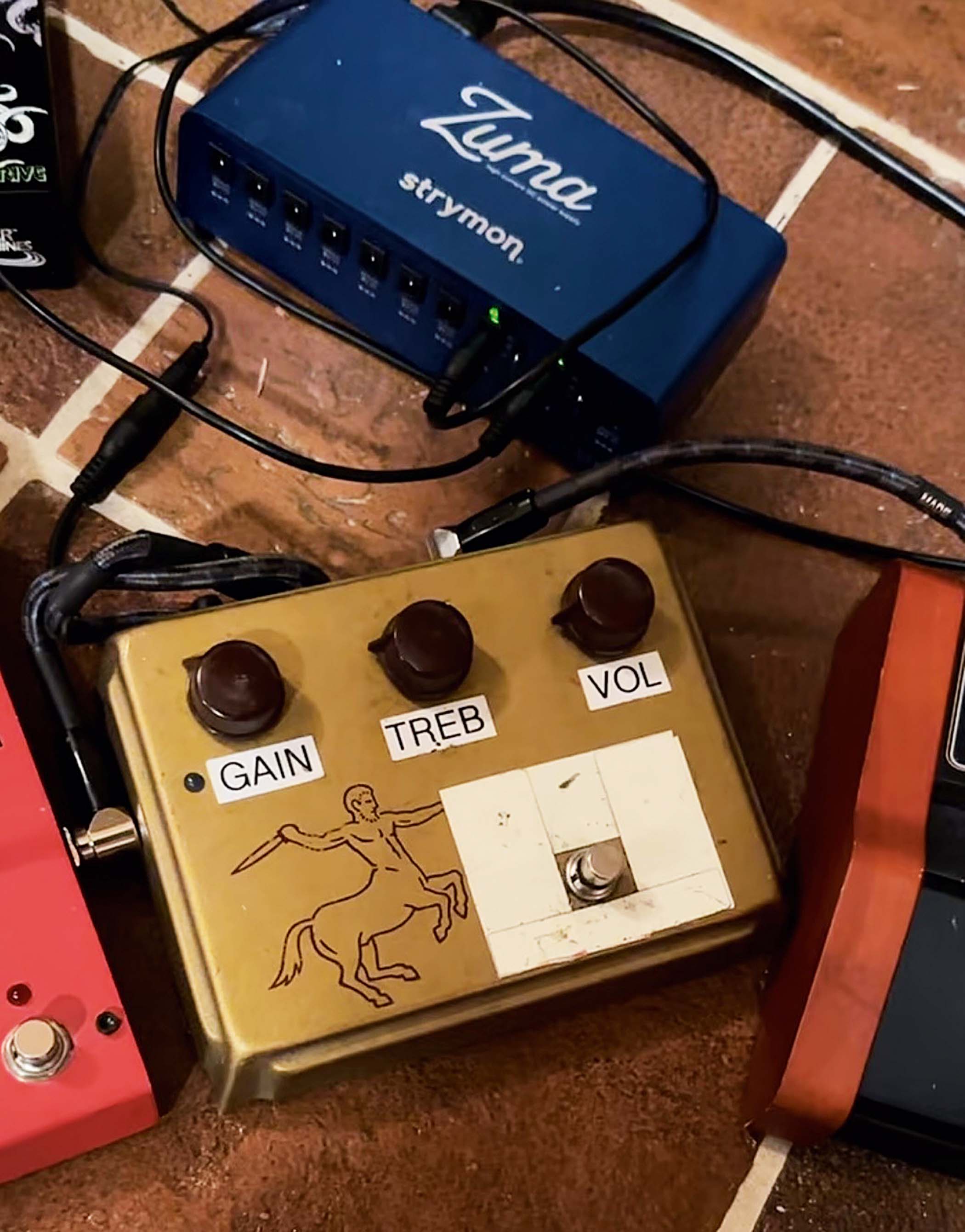 A Klon Centaur with electrical tape around the footswitch