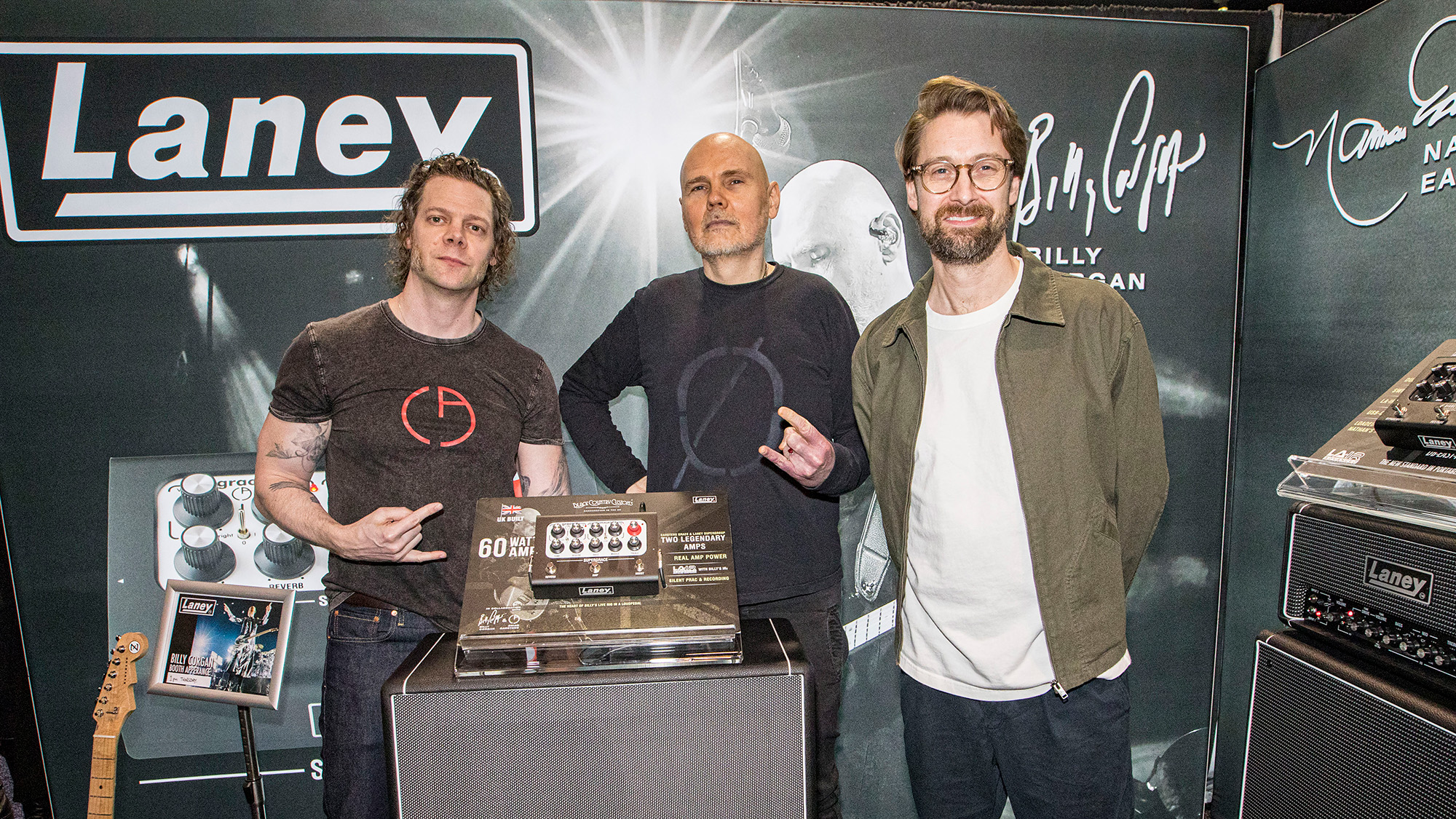 Brian Carstens, Billy Corgan and James Laney pose with the new Laney Supergrace amplifier at the NAMM Show on January 22, 2026 in Anaheim, California.