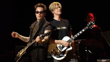 "I Was Terrified: Earl Slick Reflects on His Debut Performance with David Bowie"]