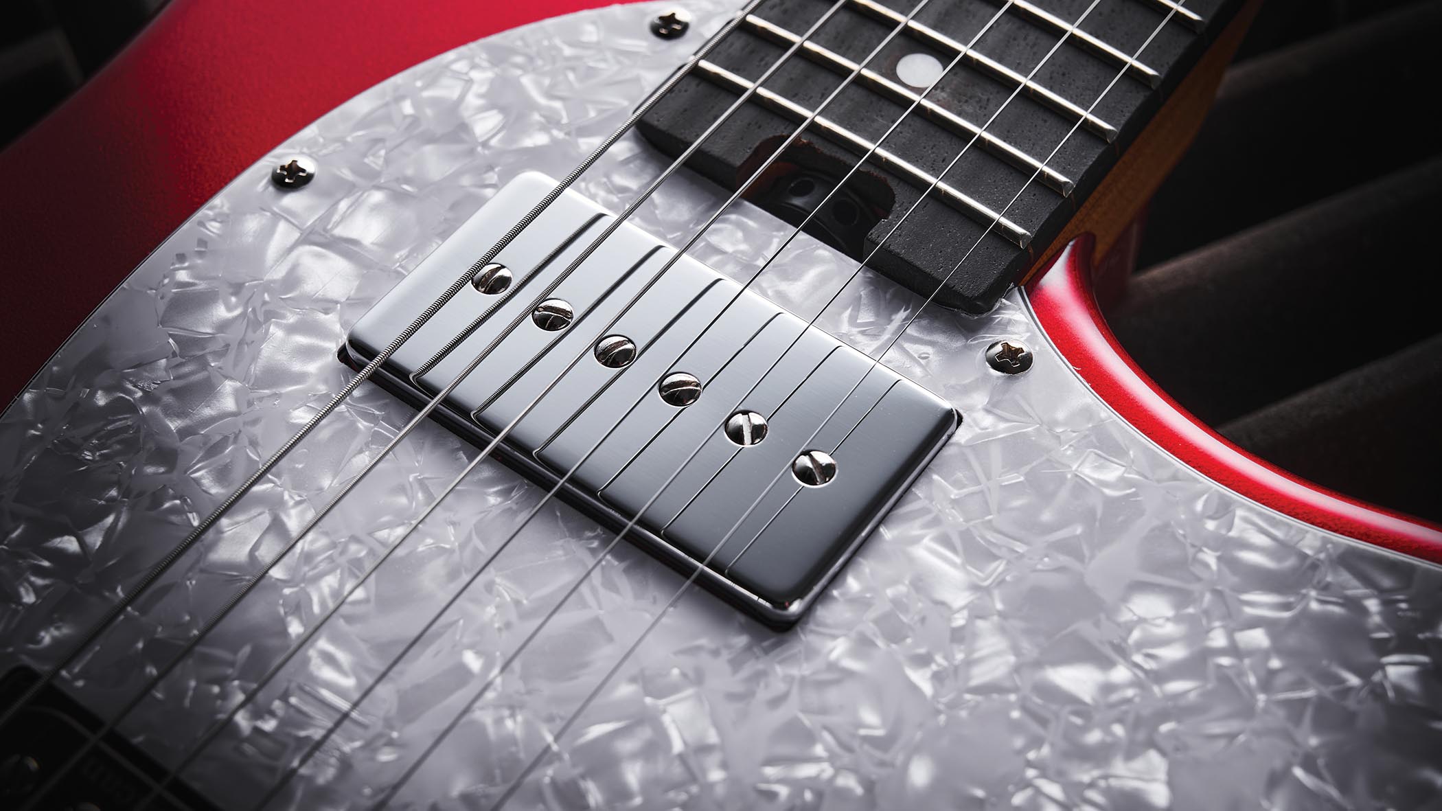 The red hardtail pickup-swapping offset is made in China, and comes with three Seymour Duncan and Guitar-X pickups included