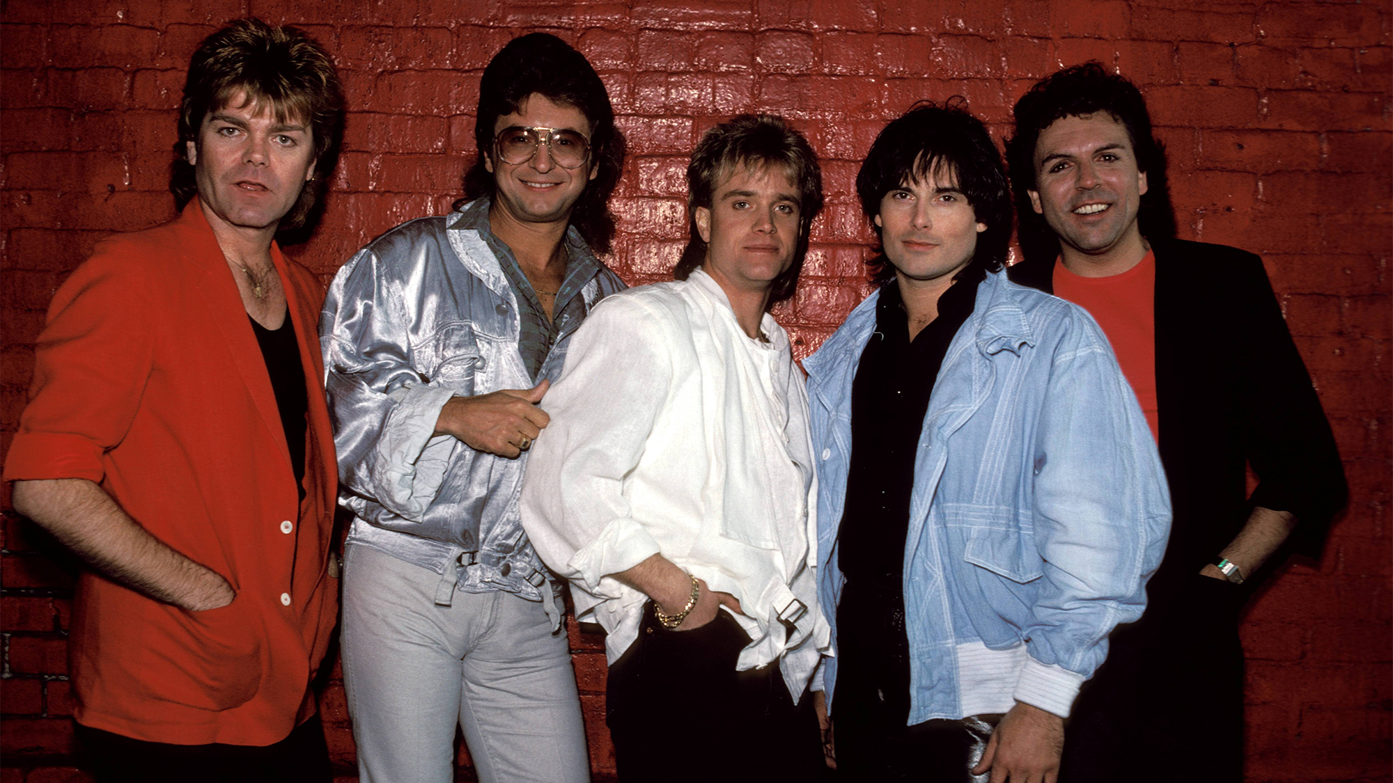 Group portrait of Survivor circa 1984. L-R Stephan Ellis (1949 - 2019), Jim Peterik, Frankie Sullivan Jimi Jamison (1951 - 2014), Marc Droubay.