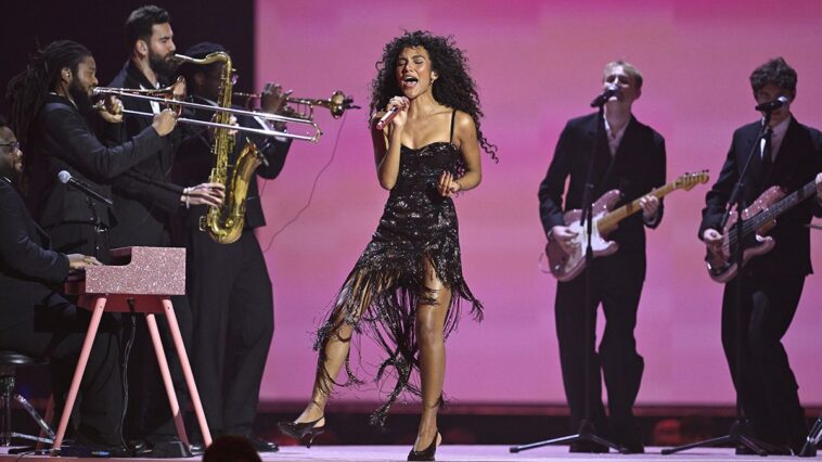 "Olivia Dean reveals that her biggest hit 'wasn’t meant to be a single' and shares how playing it during rehearsals changed her mind, plus names the Motown icon who inspires her."]