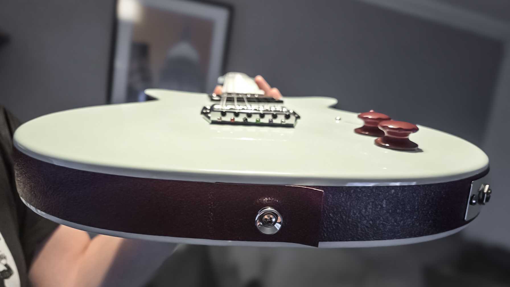 Close up of peeling border on the Dan O Cool 12-string