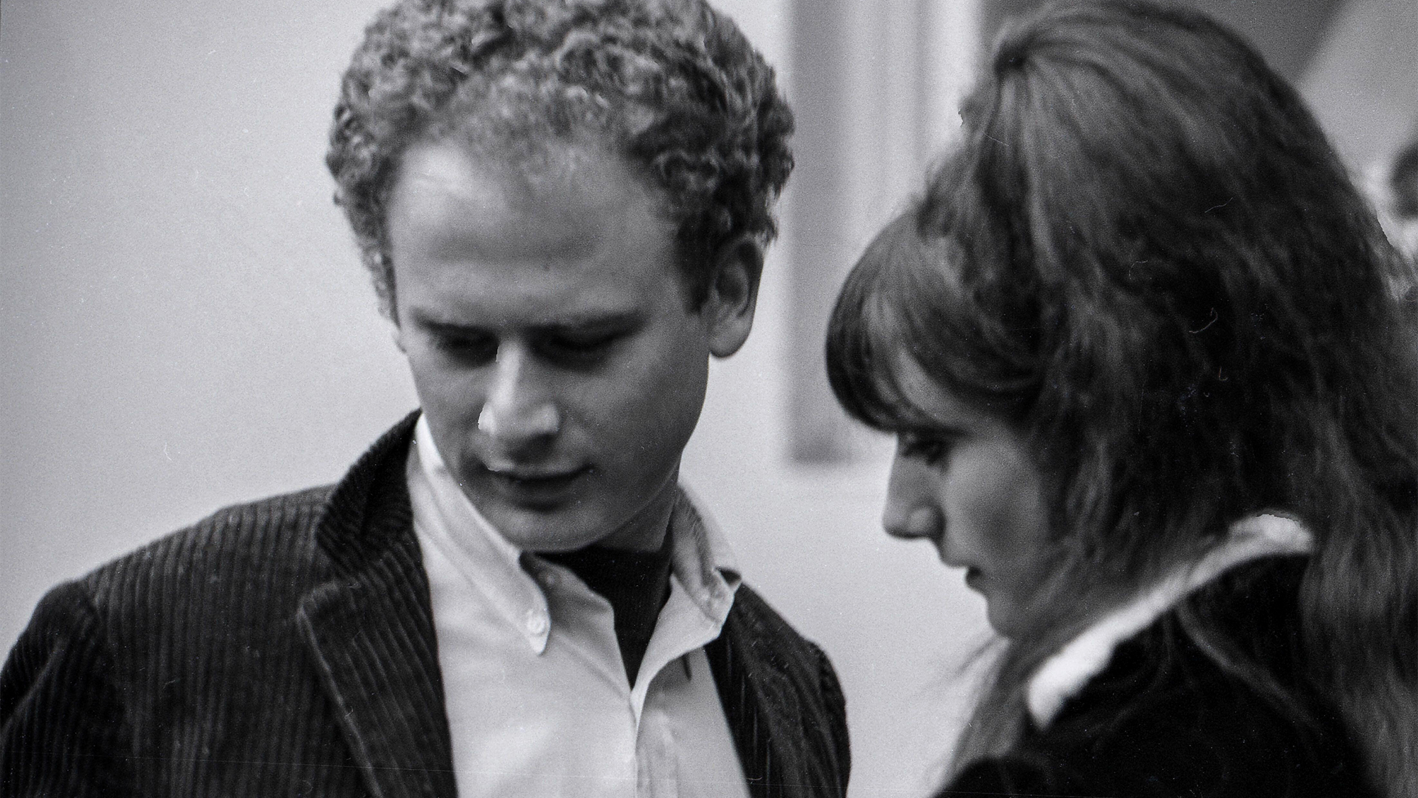 ART GARFUNKEL, left, speaks to BEVERLEY MARTYN during the Monterey Pop Music Festival, June 17, 1967, Monterey, California