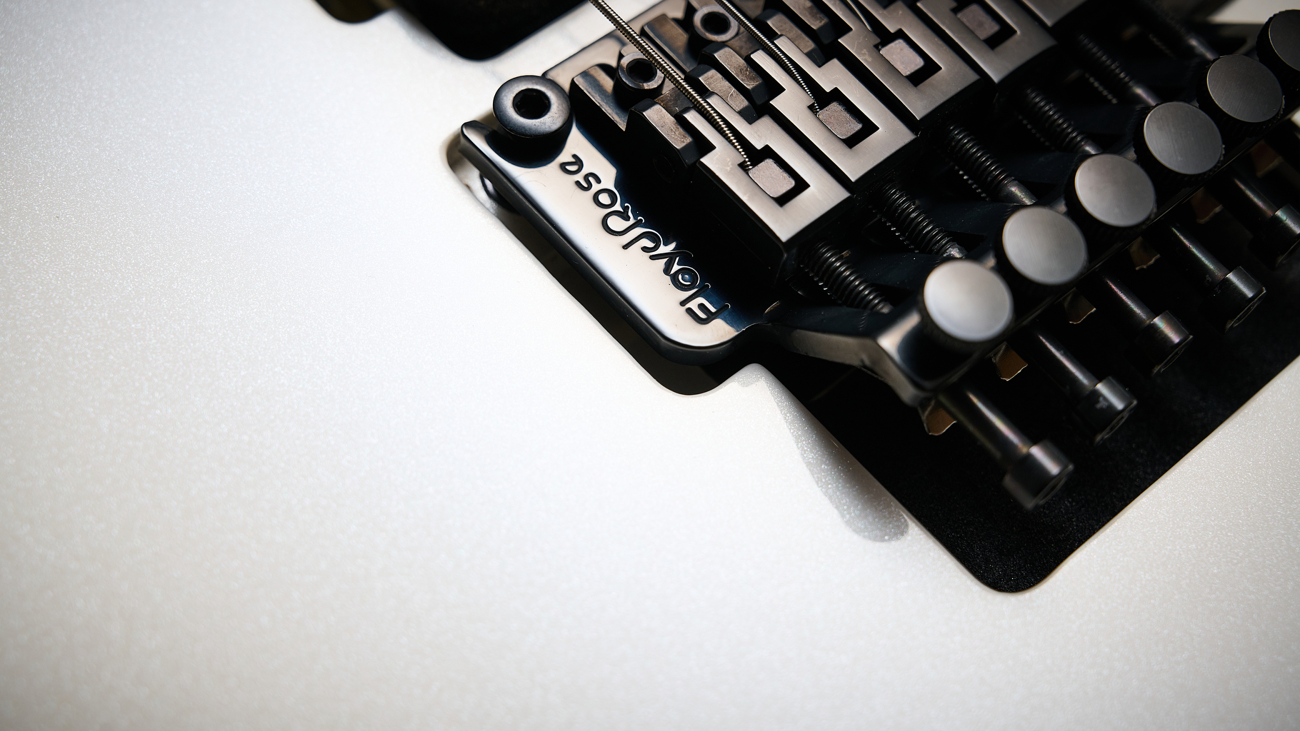 Close up of the Floyd Rose locking tremolo on a Harley Benton Fusion IV HH