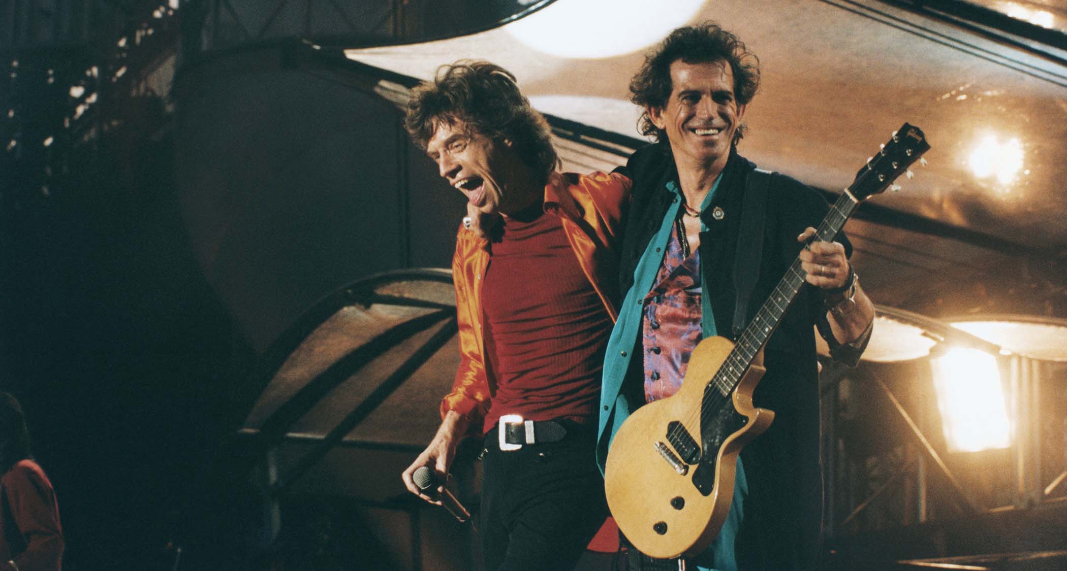 Mick Jagger and Keith Richards of the Rolling Stones, onstage in 1990, with Richards playing his TV Yellow Les Paul Junior.