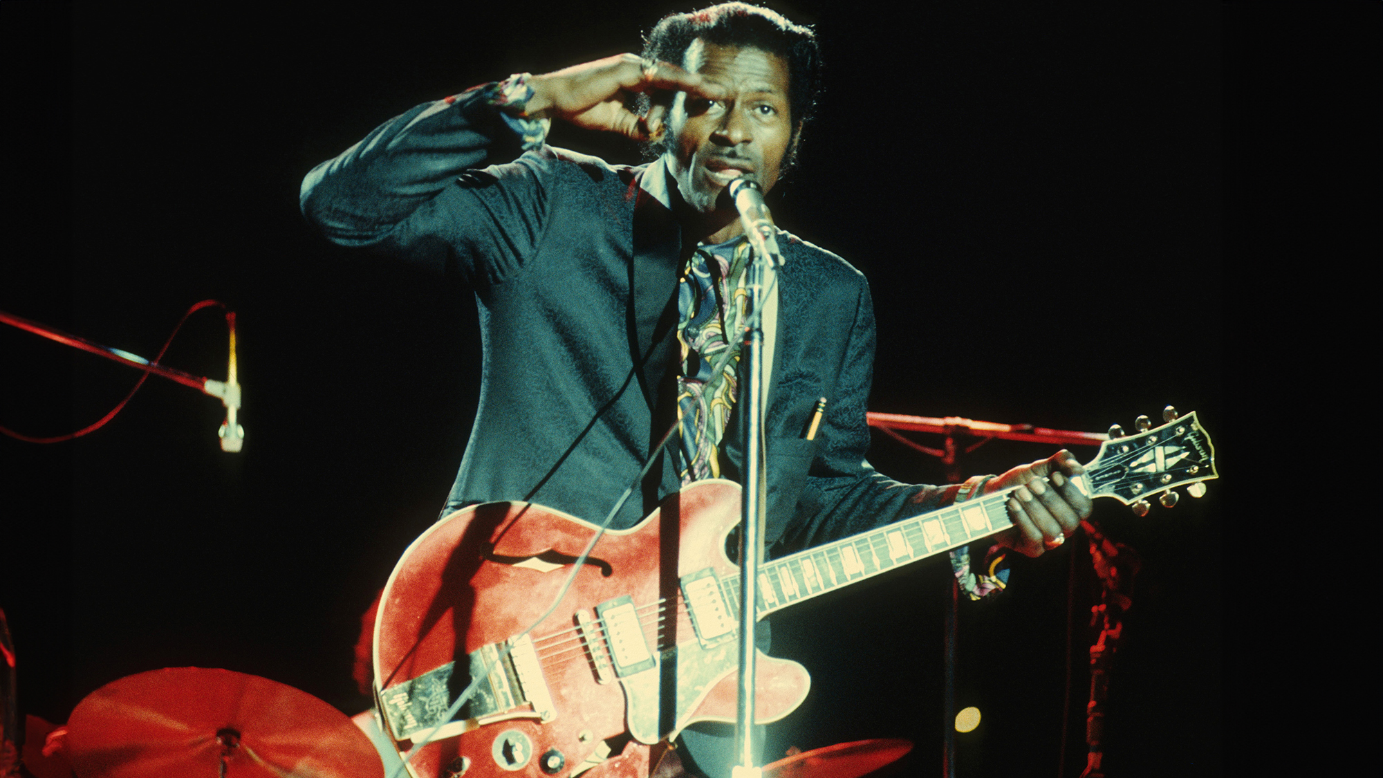 Chuck Berry performing in concert in circa 1970's. with a red Gibson ES-345 electric guitar