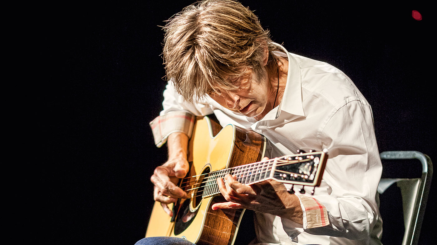 Eric Johnson plays a Martin acoustic live onstage