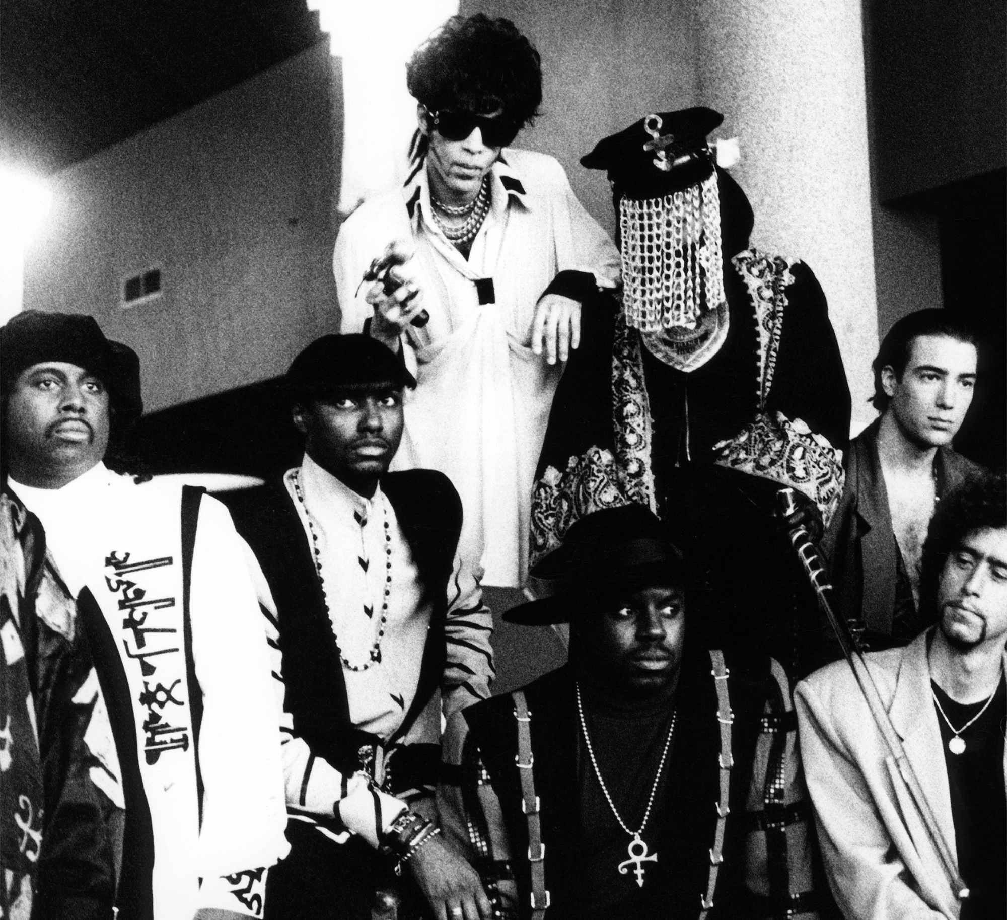 Posed group portrait of Prince (back row, centre) &amp; the New Power Generation in 1994