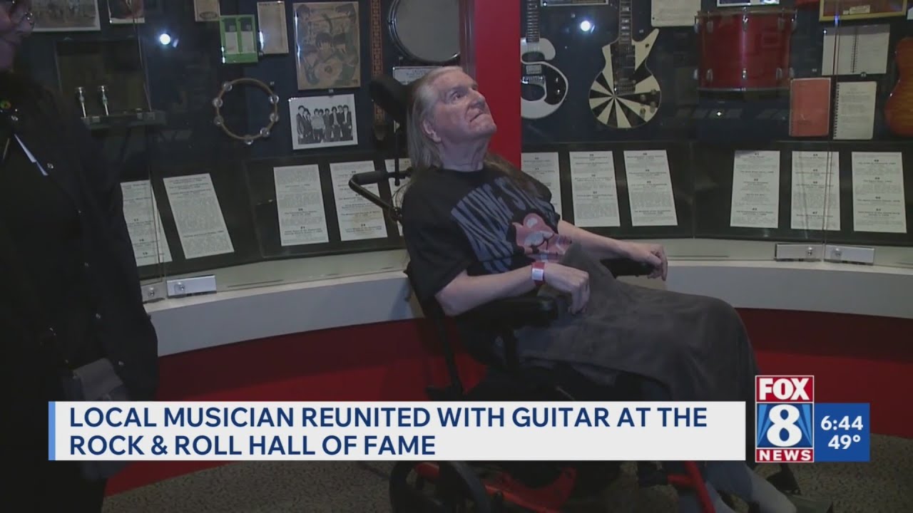 Local rock musician, a hospice patient, visits 'old friend' on display at Rock Hall - YouTube