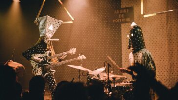 Angine de Poitrine's gig bag creates issues at airports.]