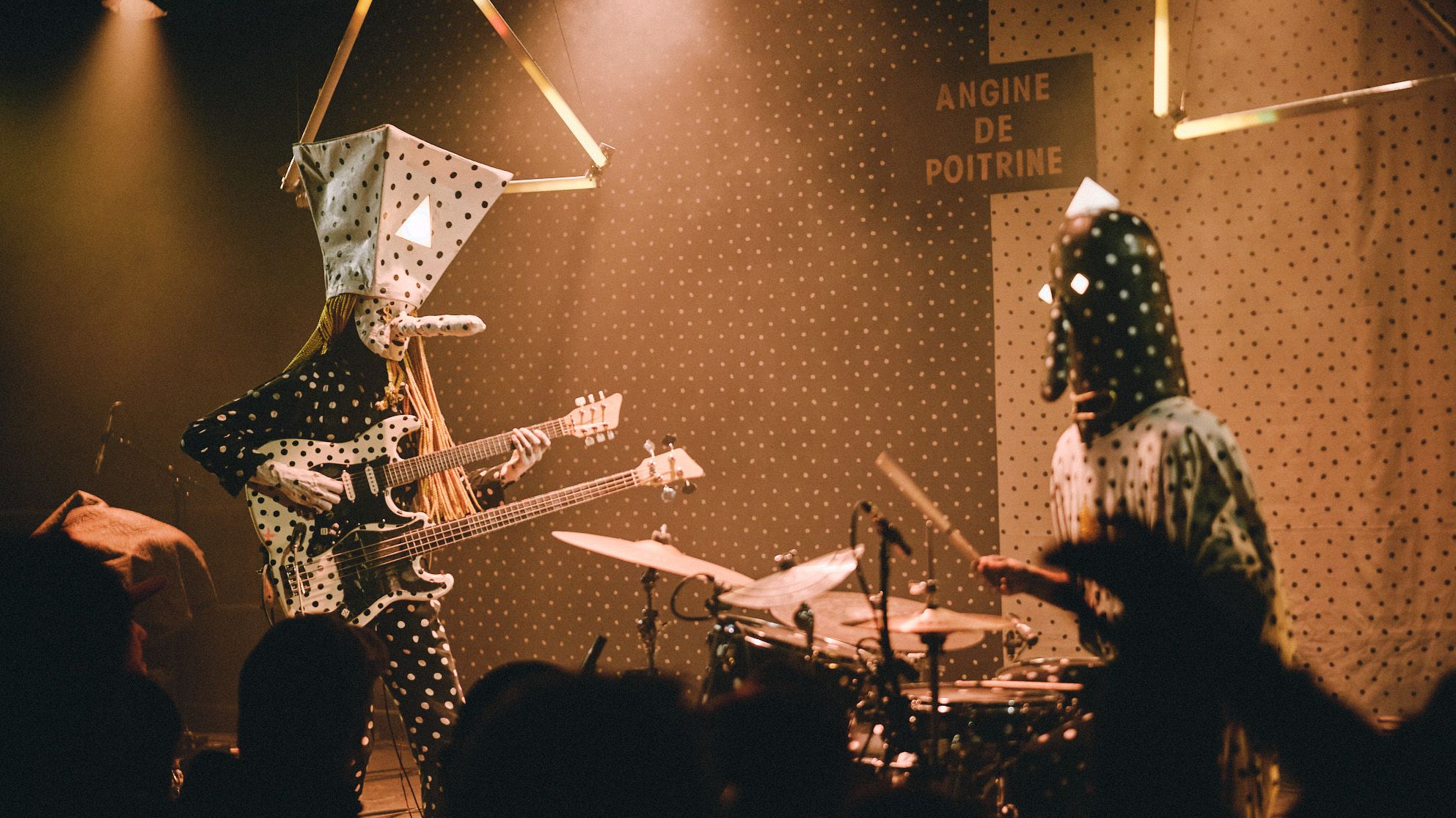 Angine de Poitrine's gig bag creates issues at airports.]