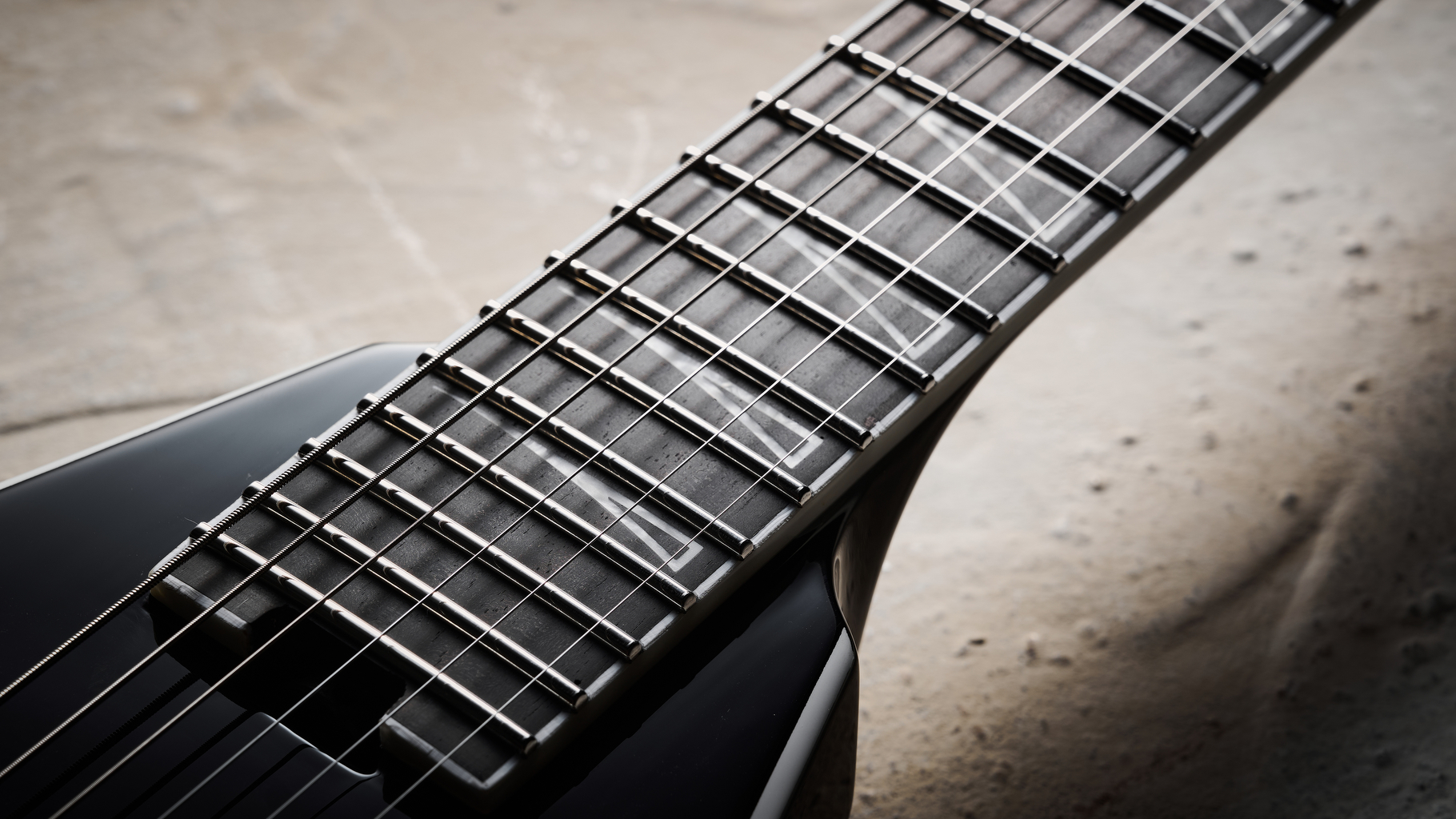 Close up of the upper registers of the ebony fretboard on the Jackson Pro Plus Series Signature Christian Andreu Rhoads RR24 EVTN6 electric guitar