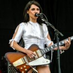 "P.J. Harvey Reveals Why She Stopped Playing Guitar Live and the Unexpected Reason for Choosing Her First Tour Guitarists"]