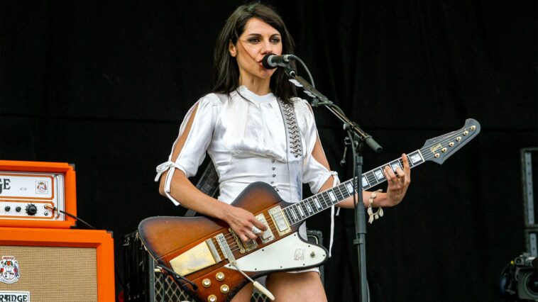 "P.J. Harvey Reveals Why She Stopped Playing Guitar Live and the Unexpected Reason for Choosing Her First Tour Guitarists"]
