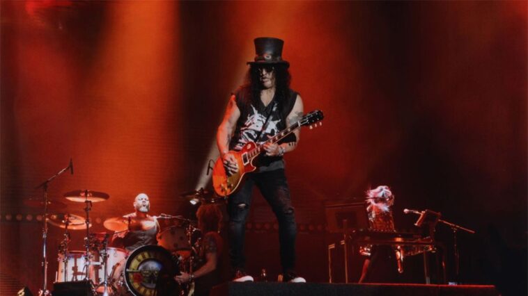 Tour-played Les Paul sets record as the highest-priced Slash guitar ever sold.]