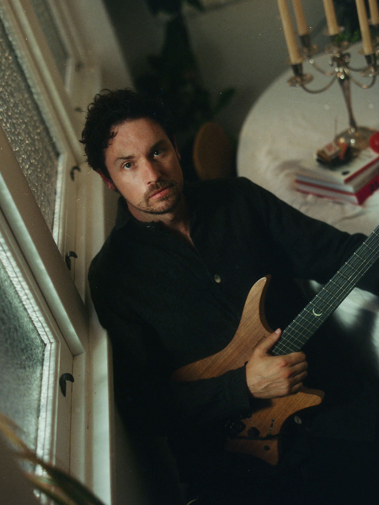 Plini poses with his signature Strandberg