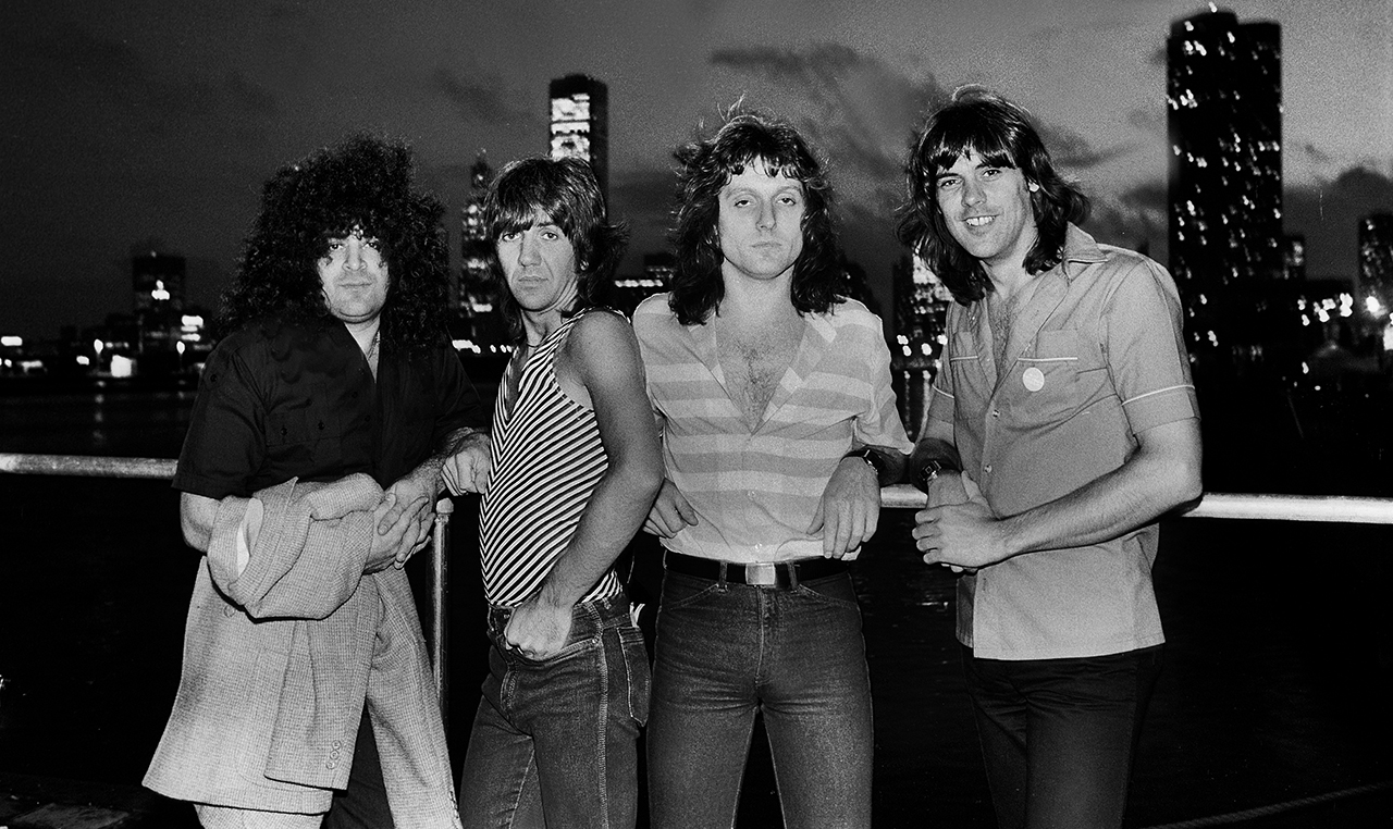 New England at Chicagofest in Chicago, Illinois, August 7, 1981. L-R: drummer Hirsch Gardner, guitarist John Fannon, keyboardist Jim Waldo, and bassist Gary Shea.