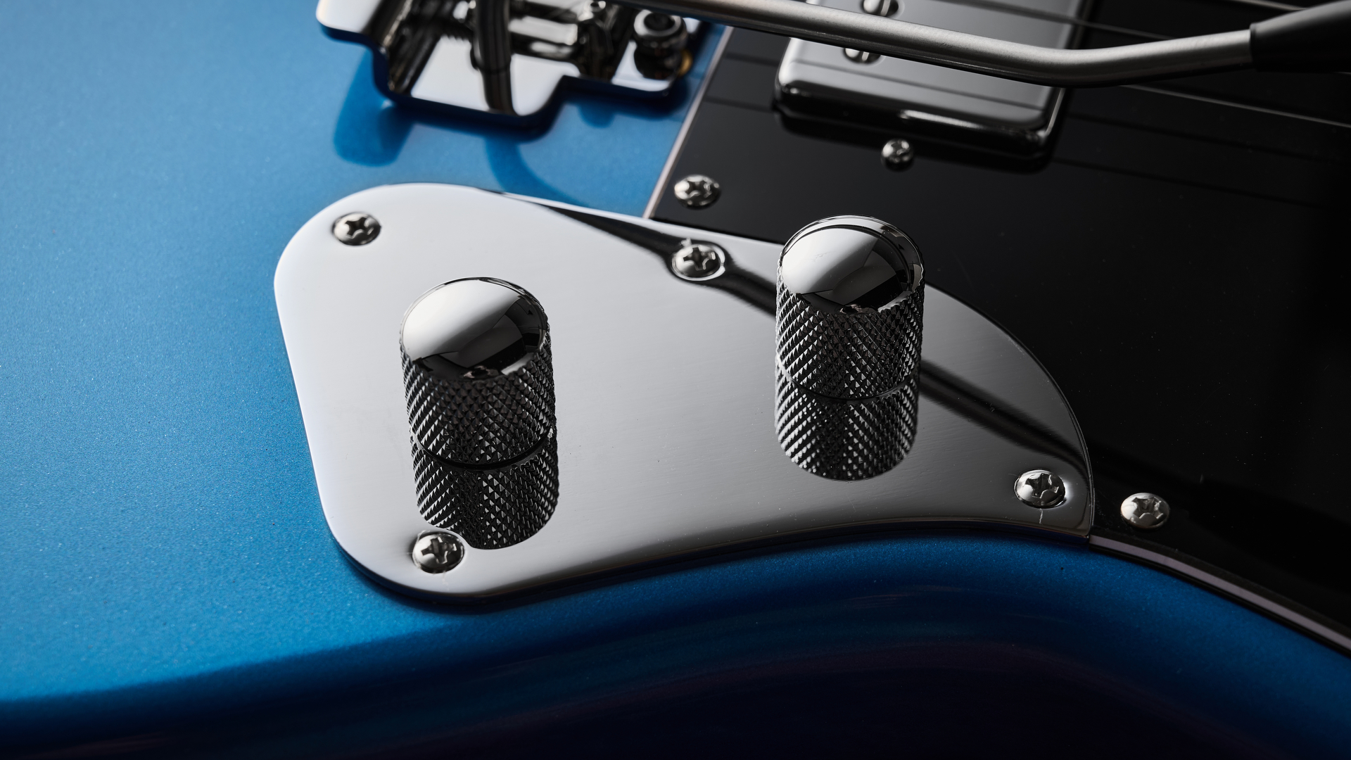 Close up of the volume and tone controls on the Sterling by Music Man StingRay Baritone guitar