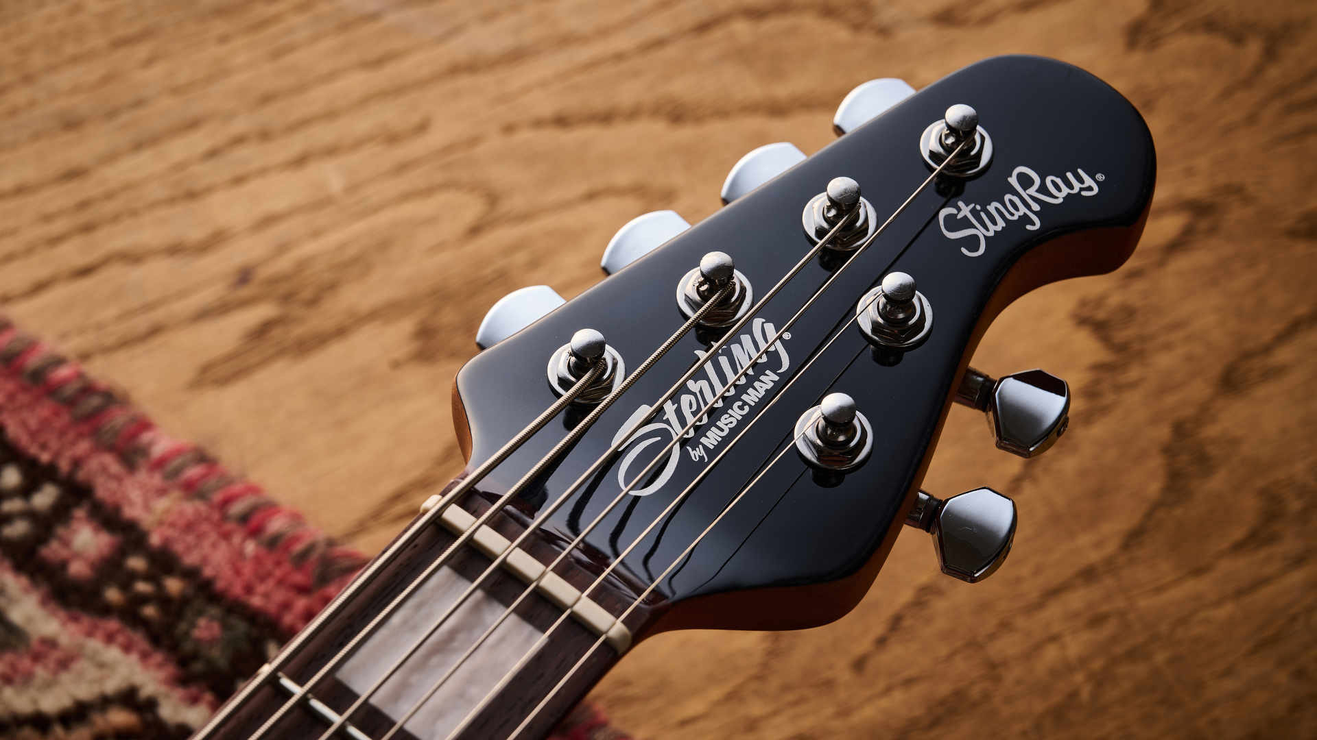 Closeup of the headstock of the Sterling by Music Man StingRay Baritone guitar