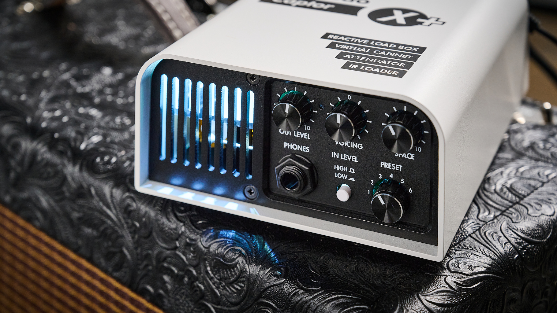 A Two Notes Torpedo Captor X Plus load box on top of a Fender amp