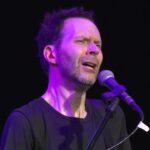 Paul Gilbert playing with a concertgoer's guitar at the Fernando Sor School 26 Paul Gilbert