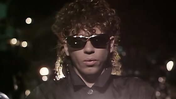 “We’re in the middle of a gig at the Palladium in Los Angeles, there’s 4000 people there, and this bloke is walking around on the stage as we’re playing. I’m like, ‘What the hell is going on?’”: How INXS got their big break in the ’80s