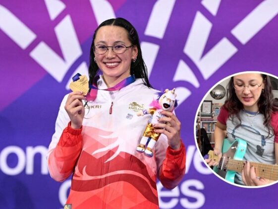 Swimmer uses gold medal as a guitar pick for a Megadeth riff
