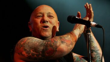 “In the early days we were AC/DC’s fave band to go and see. Malcolm and Angus and particularly Bon all jammed with us back then”: Rose Tattoo singer Angry Anderson – Aussie rock ’n’ roll outlaw and a hero to Axl Rose – has died, aged 79