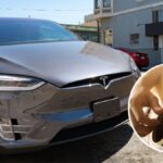 Tesla driver faces charges after allegedly playing guitar while driving