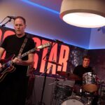 “If you’re in the front row on Keanu’s side, you’ve been warned. Your hair is going to move, but in a good way”: Keanu Reeves and Bret Domrose on pushing air with Dogstar